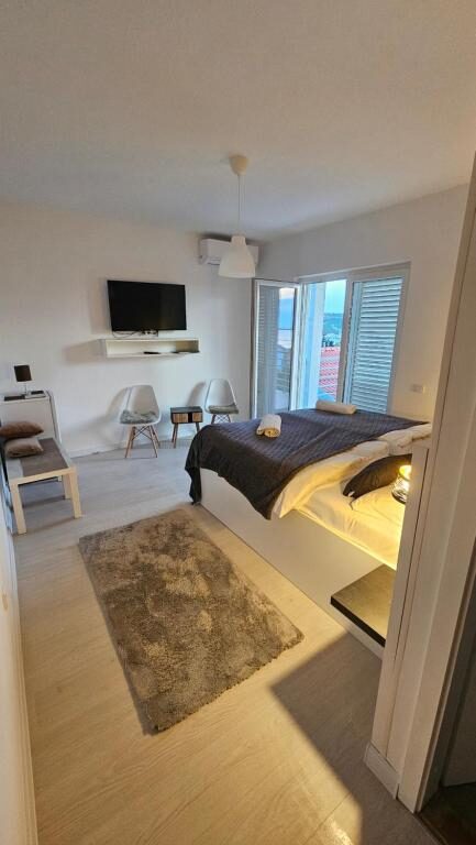 Spacious room with seating area and terrace door